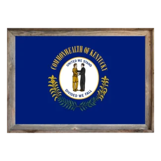 Framed Kentucky state flag showing handshake state seal on navy field, encircled by golden “Commonwealth of Kentucky” and sprigs, in rustic light‑wood frame.