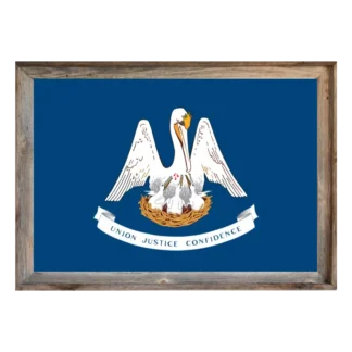 Framed Louisiana state flag showing white pelican feeding chicks on blue field with “Union Justice Confidence” ribbon, set in rustic light‑wood frame