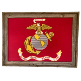 A framed United States Marine Corps flag featuring the Eagle, Globe, and Anchor emblem on a red background. The banner above reads "Semper Fidelis," and a rustic wooden frame surrounds the flag.